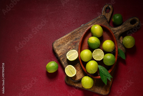 Plate with fresh ripe limes...