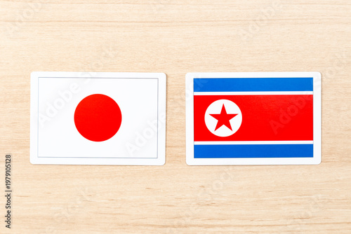 机に置かれた日本と北朝鮮の国旗 Free Download 机に置かれた日本と北朝鮮の国旗 - GFXLoad