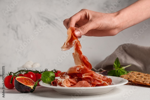 Female hand with plate of d...