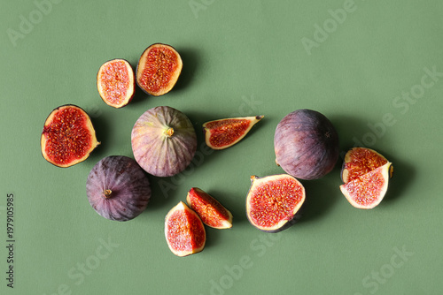 Fresh ripe figs on green ba...