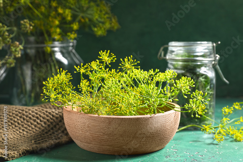 Bowl with fresh dill on gre...