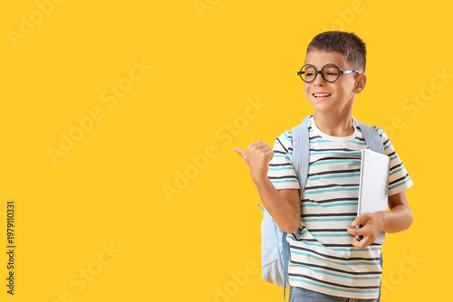 Little schoolboy with table...