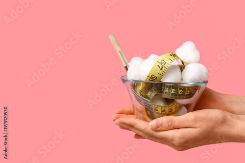 Female hands with bowl of c...