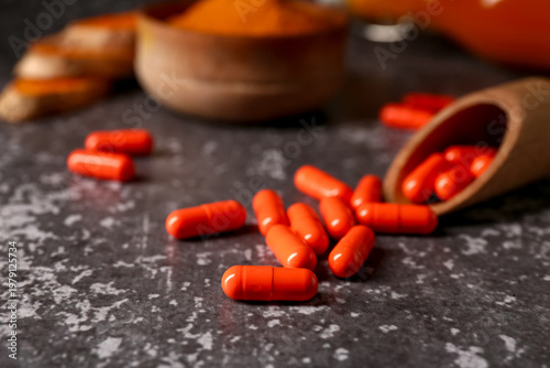 Turmeric root capsules on d...