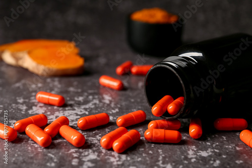 Bottle with turmeric root c...