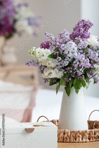 Vase with lilac flowers on ...