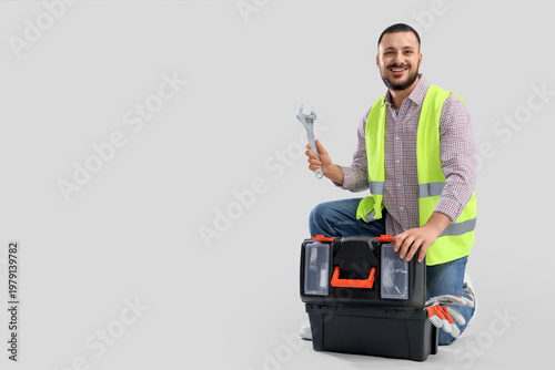 Male constructor with wrenc...