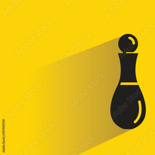 perfume spray bottle with drop shadow in yellow background