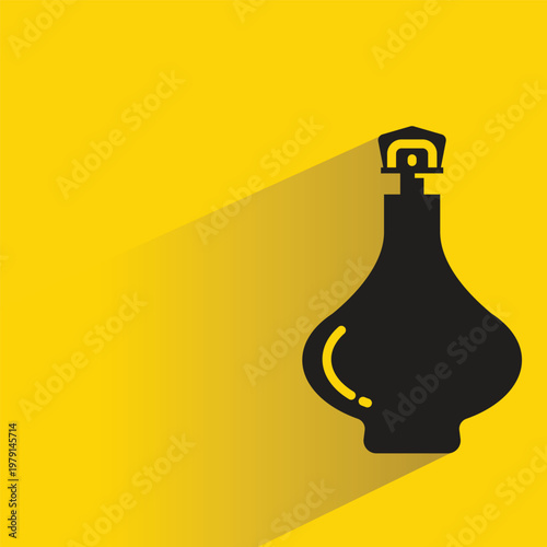 perfume spray bottle with drop shadow in yellow background