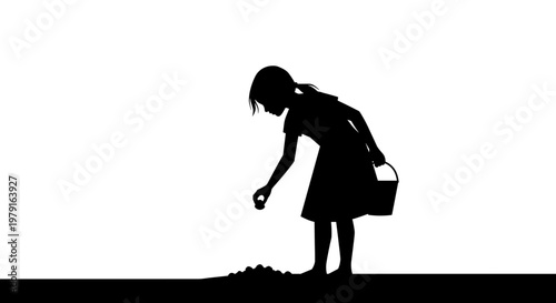 Silhouette of girl picking flowers.