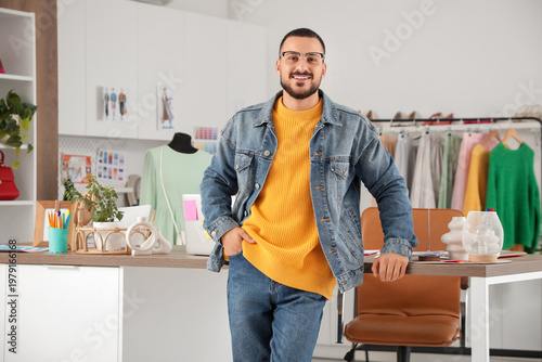 Happy male stylist working ...
