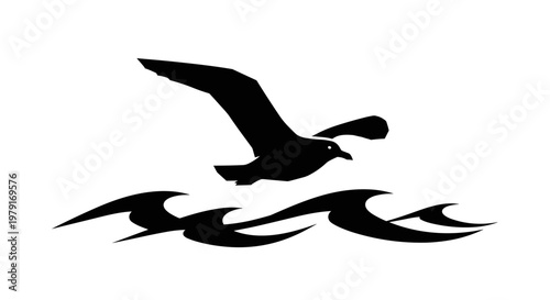 Seagull flying over ocean waves.