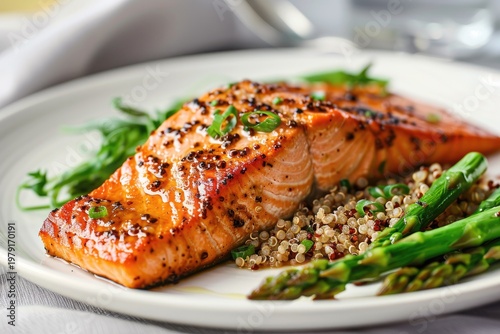 Grilled Salmon Fillet with Quinoa and Asparagus on White Plate.