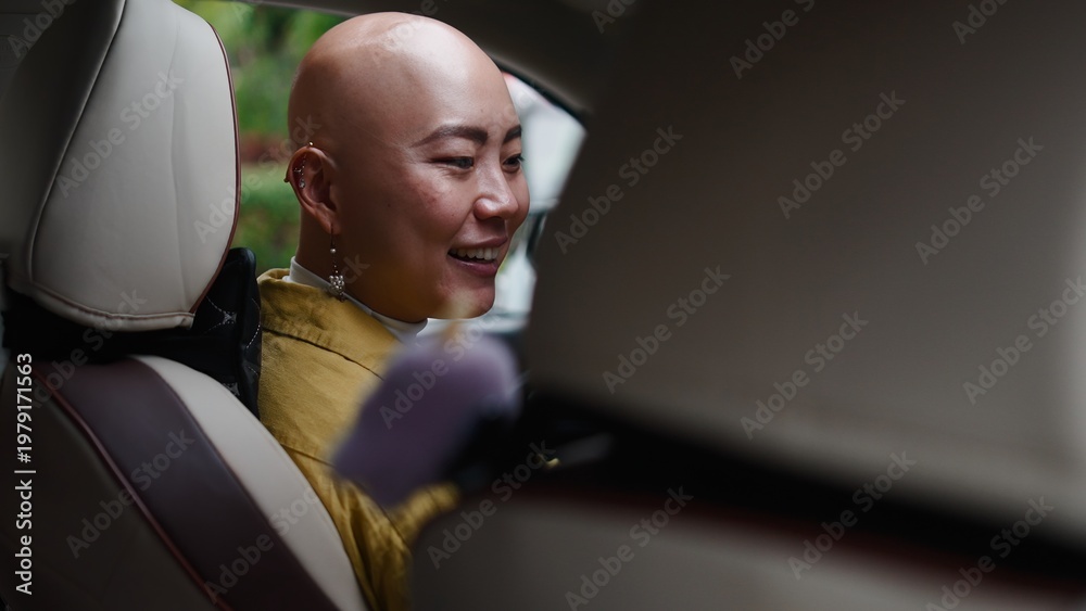 Fototapeta premium Asian woman smiling and riding in car, enjoying journey with friends