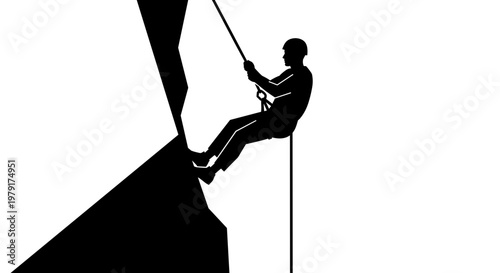 Silhouette of man rock climbing.