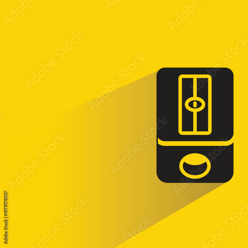 pencil sharpener with shadow on yellow background