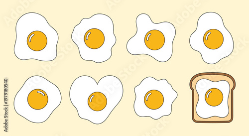Assortment of fried eggs cooked in various irregular shapes along with a heart-shaped egg and a piece of breakfast egg on toast.