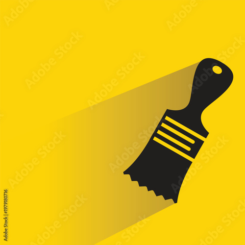 paint brush icon with shadow on yellow background