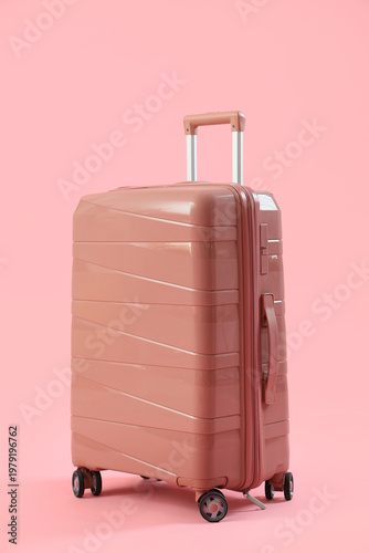 Big suitcase on pink backgr...