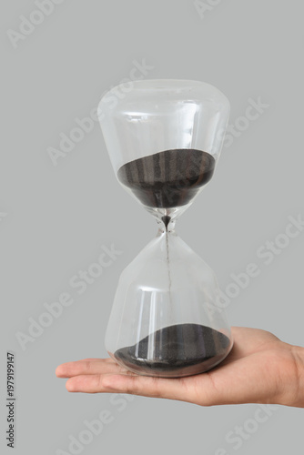 Female hand holding hourgla...