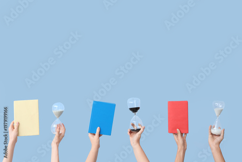 Female hands holding hourgl...