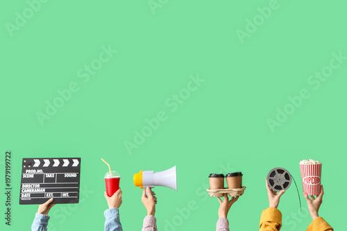 Many hands with movie clapp...