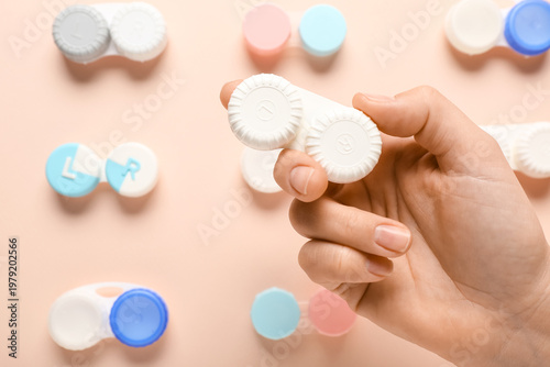 Female hand with containers...