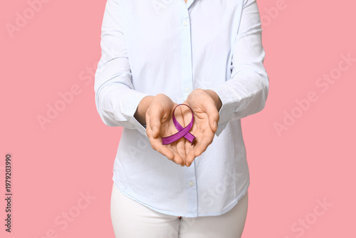 Woman with purple ribbon on...