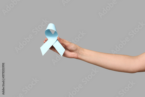 Female hand with light blue...