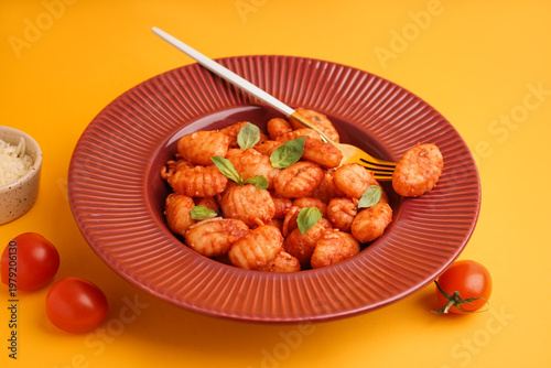Plate of tasty gnocchi with...