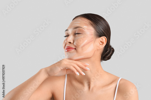 Young Asian woman with cont...