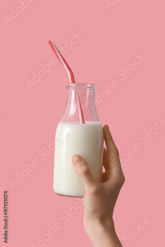 Hand holding bottle of milk...