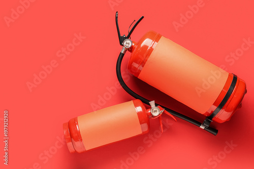 Fire extinguishers on red b...