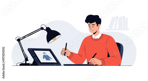 Young man drawing on digital tablet with stylus, creative workspace with desk lamp