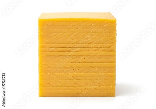 A block of cheese is sitting on a white surface