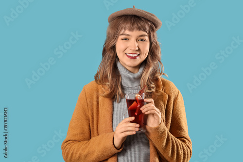 Smiling young woman in warm...