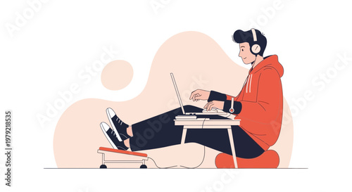 Young man with headphones working on laptop, comfortable home office setup, relaxed pose
