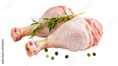 Two raw chicken drumsticks with fresh rosemary herb and peppercorns isolated on transparent background.