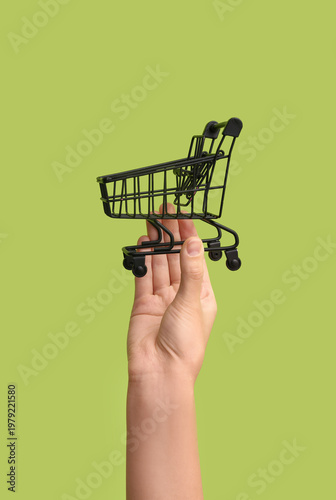 Female hand with black shop...
