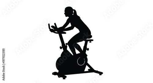 Woman exercising on a stationary bike a striking black silhouette