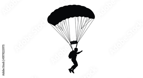 A skydiver descends with an open parachute a striking silhouette