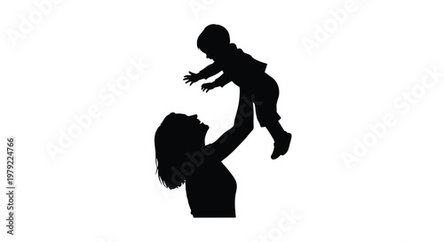 A mother playfully tosses her child in the air a striking silhouette