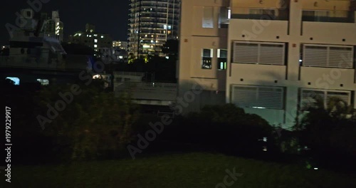 Vew from inside the car, a view of Japanese city at night