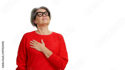 Photos Senior woman expressing patriotism with hand on heart