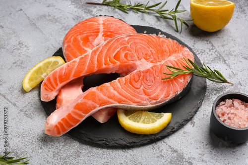 Wooden board with raw salmo...