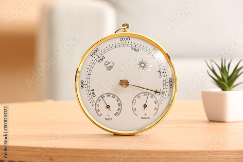 Tableau sur toile Aneroid barometer on table in room, closeup
