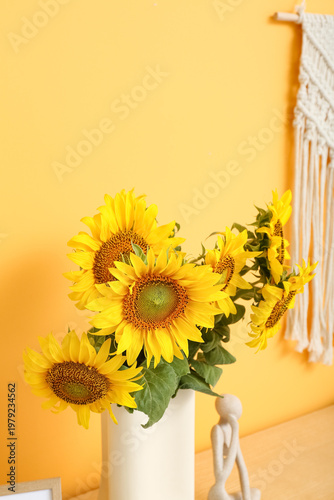 Vase with sunflowers in liv...