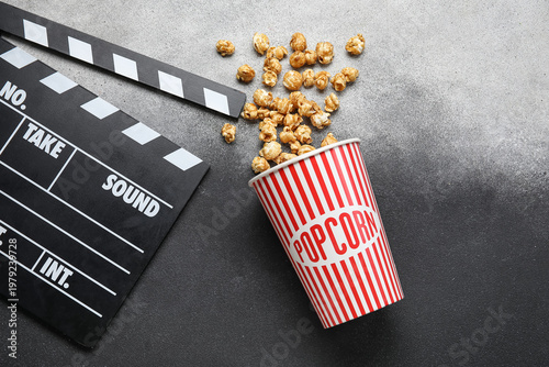 Bucket with tasty popcorn a...