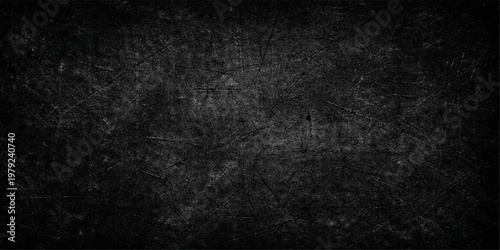A dark and black grunge background featuring a textured stone wall pattern with a rough aged surface of old gray concrete and scratched vintage paper