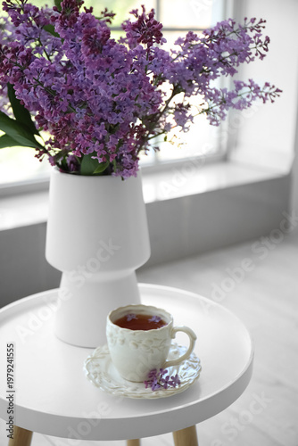 Vase with blooming lilac fl...
